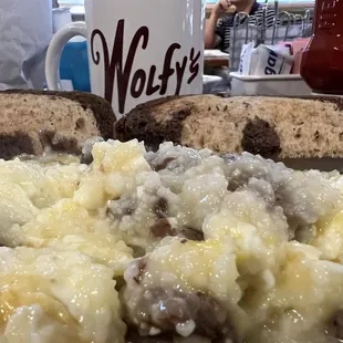 This is how my Grandpa would eat this breakfast. Eggs Sausage and Grits. All mixed up. A perfect bite each time.