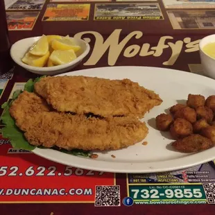 Fried Tilapia, cheese grits and deep fried okra, with lemon to squeeze on the fish and sweet tea!