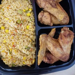 Fried chicken wings with Jollof rice