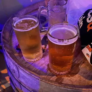 beer glasses on a barrel