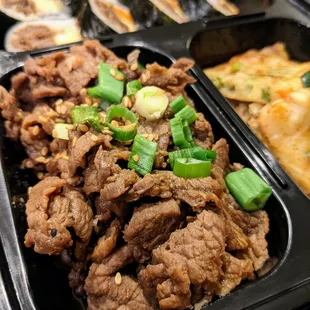 C1. Bulgogi, Kimbap &amp; Buchimgae. Close-up of beef bulgogi. $9.99.