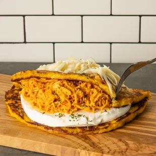 sweet corn pancakes, chesse and chicken. (cachapa)