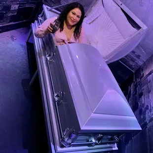 a woman opening a casket