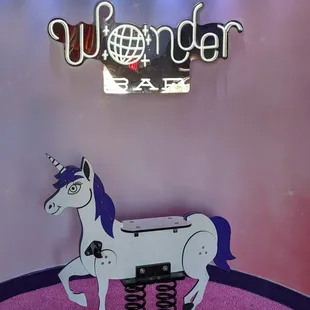 a white horse with a blue mane