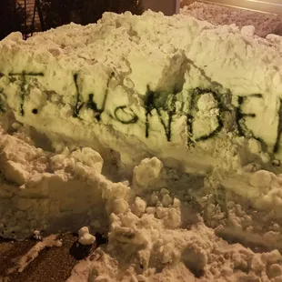 the word wonder written on a pile of snow
