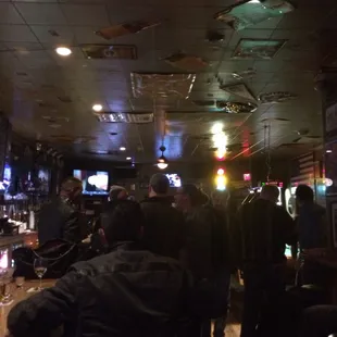 a group of people watching televisions