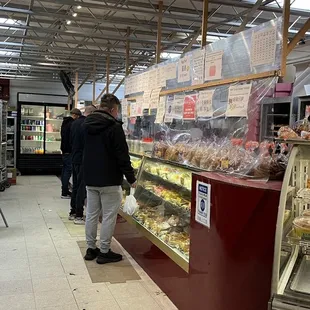 a woman standing in front of the counter