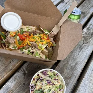 Pulled pork nachos and coleslaw.
