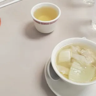 a bowl of soup and two bowls of soup