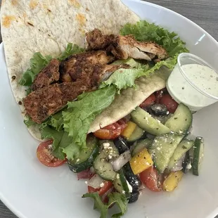 Chicken gyro with no onions or tomatoes sauce on the side