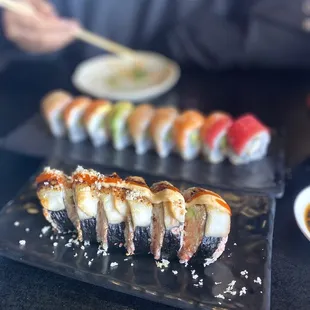 Rainbow Roll in back,  beautiful roll that&apos;s name I have forgotten in the front