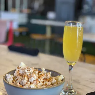 Complimentary Popcorn and Mimosa...duh!! It&apos;s brunch lol