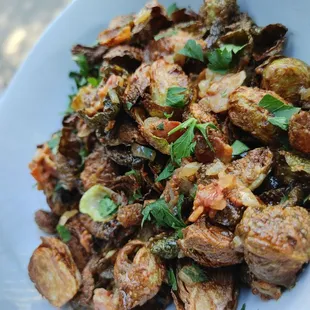 a plate of food with meat and vegetables