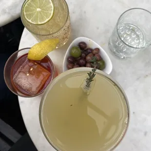 Happy hour Margarita, happy hour "Whiskey Drink," and "Mommy's Thyme Out" plus a side of olives