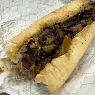 a sandwich with meat and vegetables