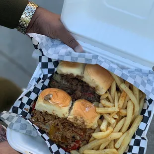 a person holding a box of food