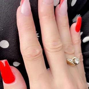 Coffin shaped, red and white French tips with a top of glitter