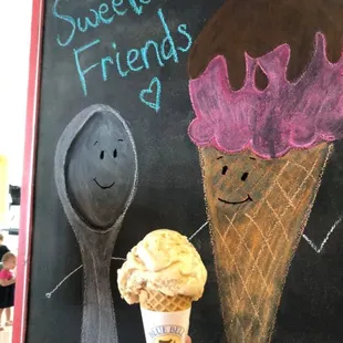 an ice cream cone and a spoon