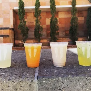 a row of four different drinks