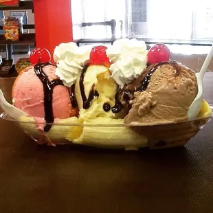 a banana split with ice cream and chocolate syrup