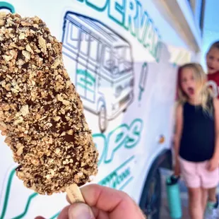 Better Buddy ice cream bar.  Butter Pecan ice covered in rich chocolate and topped with peanut butter wafer cookies