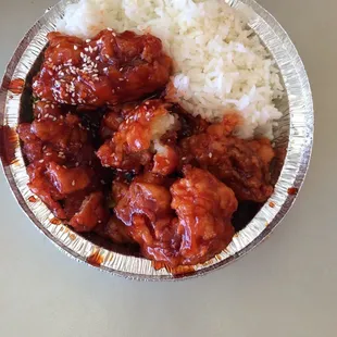 a bowl of rice and meat