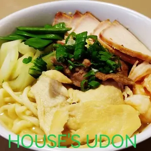 a bowl of noodles and meat