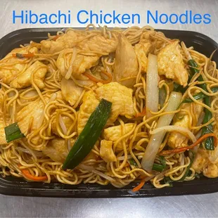 a plate of chicken noodles