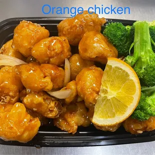 a tray of chicken and broccoli