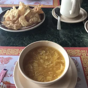 Egg flower soup with crispy chips and hot green tea.