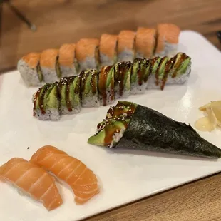Salmon nigiri, Eel Avocado Roll and hand roll, the back is a salmon roll with spicy salmon