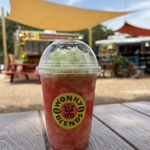 a drink with a straw in a plastic cup