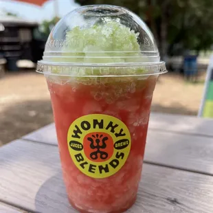 a drink with a straw in a plastic cup