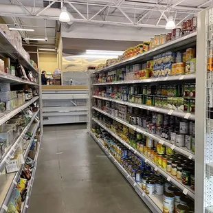 a grocery aisle with canned goods