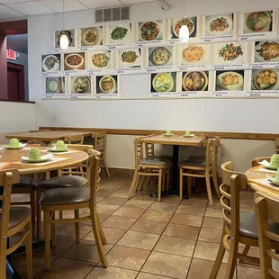 a dining area with tables and chairs