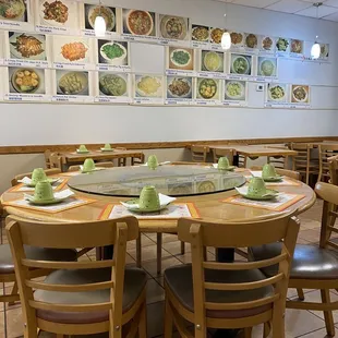 a dining room with a table and chairs