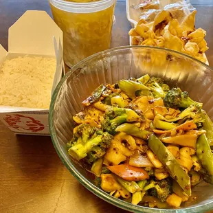 a bowl of broccoli and a bowl of rice