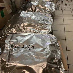 a long line of wrapped up food items