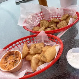 Fried pickles and red pepper hummus