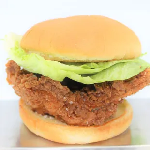 a chicken sandwich with lettuce