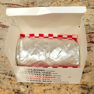 The Burrito has grilled chicken, egg, cheese, and rice in a flour tortilla.