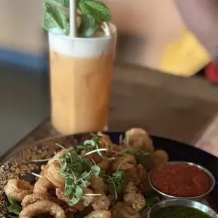 Crispy Calamari and carrot cinnamon sour. Amazing atmosphere and service. A must do.