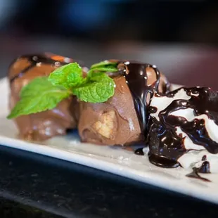 Profiteroles
 cream puffs + chocolate drizzle