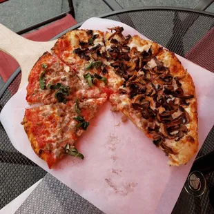 Half sausage with red sauce and mushroom pizza.