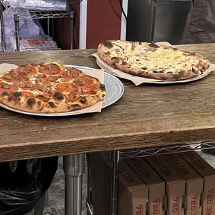 Carnivore pizza on the left.