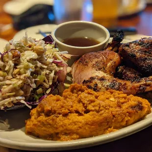 Half chicken with coleslaw and mashed sweet potatoes
