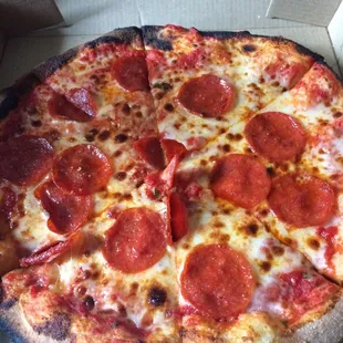 a pepperoni pizza in a box