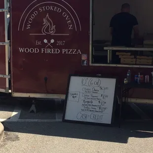 a food truck with a menu