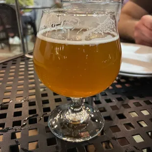 a glass of beer on a table