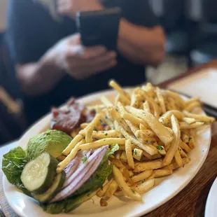 a plate of french fries and a sandwich